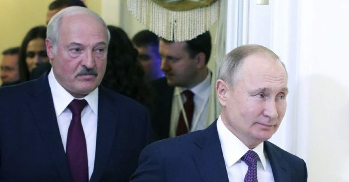 In this file photo, Russian President Vladimir Putin (R) and Belarusian President Alexander Lukashenko walk before a meeting of the Supreme Eurasian Economic Council, St. Petersburg, Russia, Dec. 20, 2019. (AP Photo)