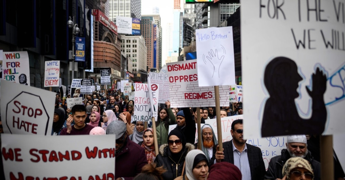 Demonstrators take part in a protest against growing Islamophobia, white supremacy and anti-immigrant bigotry following the attacks in Christchurch, in Time Square, New York City, March 24, 2019.