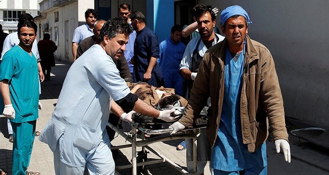 Men transport a victim at a hospital after a blast in Kabul, Afghanistan March 21, 2018. (Reuters Photo)