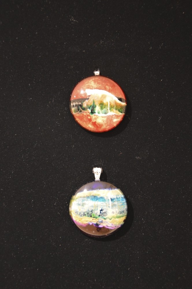 Kaiyrgul Kazybekova creates glass engraved jewels as well as abstract and still life paintings and charcoal drawings.