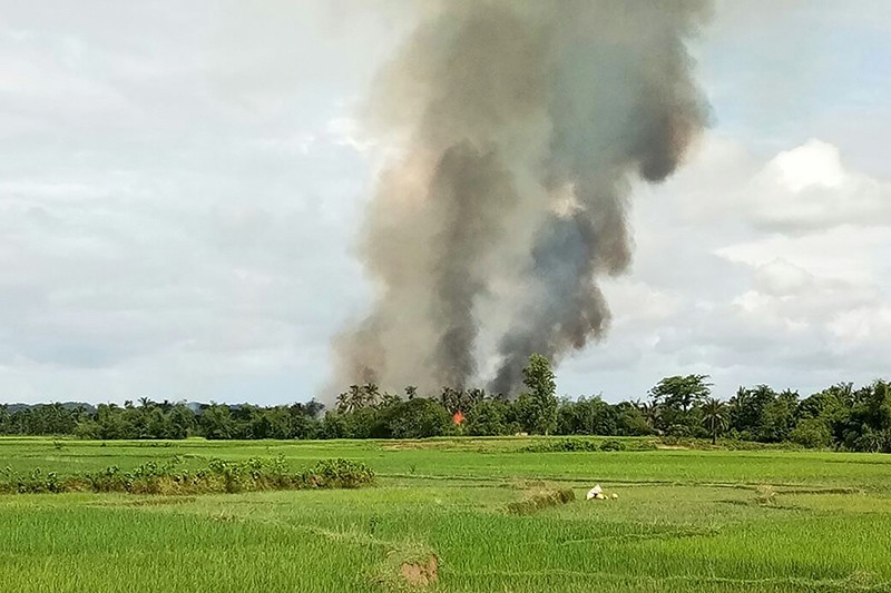 Smoke rises from what is believed to be a burning village in the area near Maungdaw in Myanmar's Rakhine state on Aug. 30, 2017. (AFP Photo)