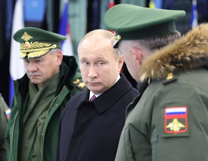 Russian President Vladimir Putin (C) with Russian Defense Minister Sergei Shoigu (L) as they visit the 'Peter the Great Military Academy' of the Russian Strategic Missile Forces, in Balashiha outside Moscow, Russia, Dec. 22, 2017. (EPA Photo)