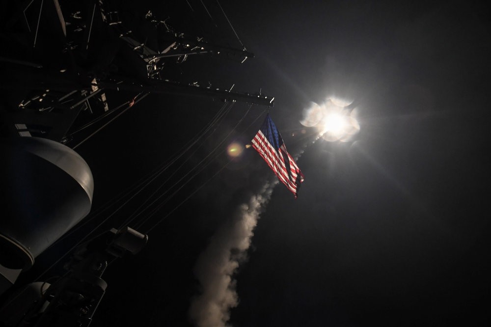 Tomahawk missiles are fired from U.S. warships in the Mediterranean Sea, targeting an air base in retaliation for the Idlib chemical weapons attack by the Assad regime on Tuesday, April 7. (Reuters Photo)