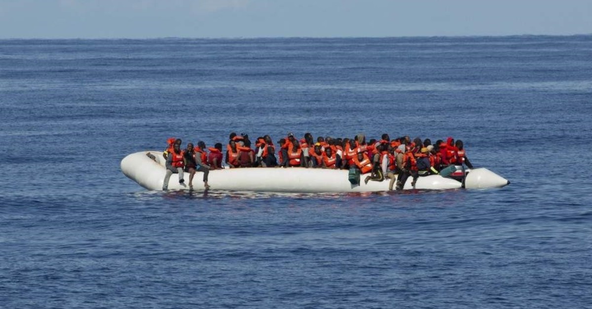 Migrants are seen on a dinghy boat off the coast of Libya, Oct. 26, 2019. (AP Photo)