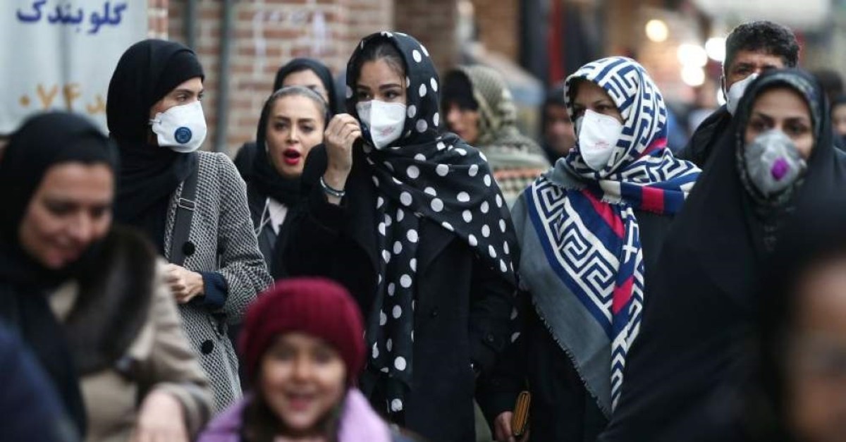 Iranian women wearing protective masks to prevent contracting a coronavirus walk at Grand Bazaar in Tehran, Iran Feb. 20, 2020. (West Asia News Agency/Nazanin Tabatabaee via Reuters)