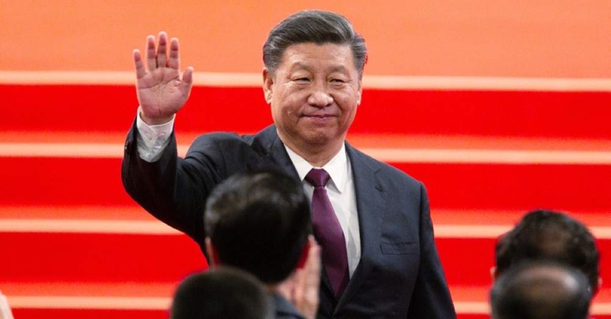Chinese President Xi Jinping waves during an inauguration ceremony to mark the 20th anniversary of the former Portuguese colony's handover to Chinese rule, Macao, Dec. 20, 2019. (AP Photo)