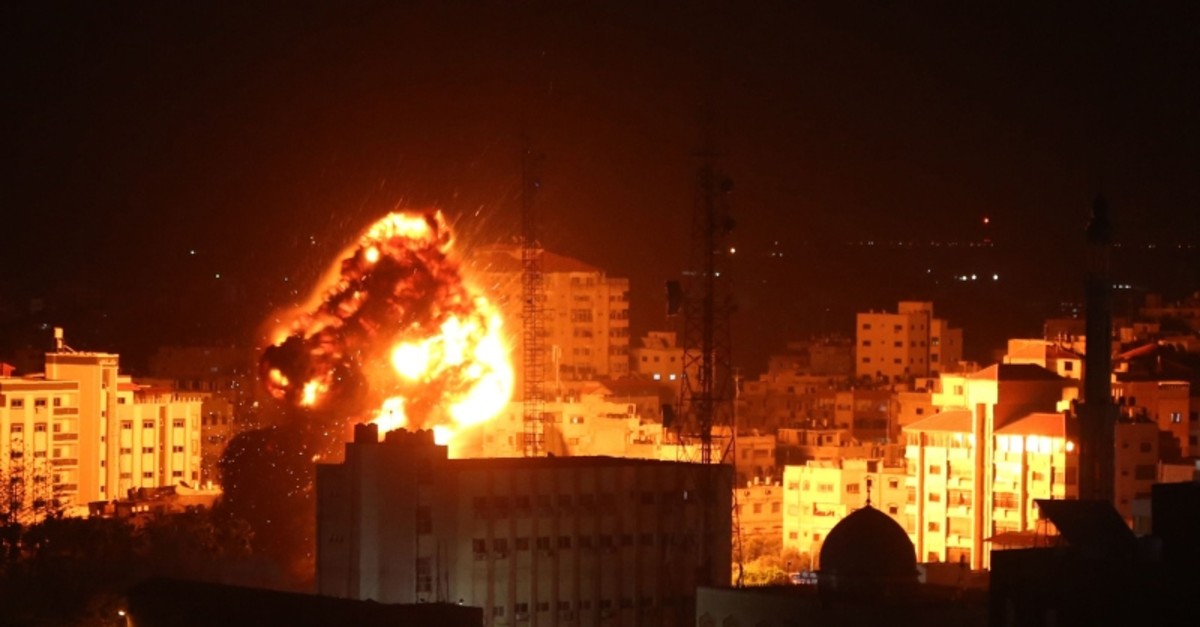 A ball of fire belows above buildings in Gaza City during reported Israeli strikes on March 25, 2019 (AFP Photo)