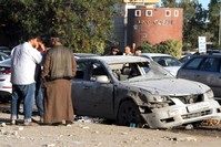 Libyans check the site of an airstrike in the town of Zawiya, 45 kilometers west of Tripoli, Dec. 26, 2019. (AFP Photo)