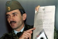 Dzokhar Dudayev presents a document to the press which he says proves Kremlin is planning to deport the Chechen population during a press conference in Grozny, Dec.15, xxxx.