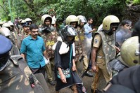 Indian activist Rehana Fatima (C) walks with police wearing protective gear near the Lord Ayyappa temple complex at Sabarimala in India's Kerala state on October 19, 2018. (AFP Photo)