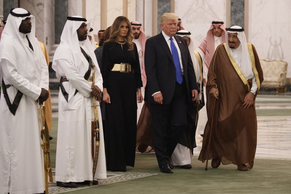 President Trump and first lady Melania Trump walk with Saudi King Salman to a presentation ceremony at the Royal Court Palace, Riyadh, May 20. 