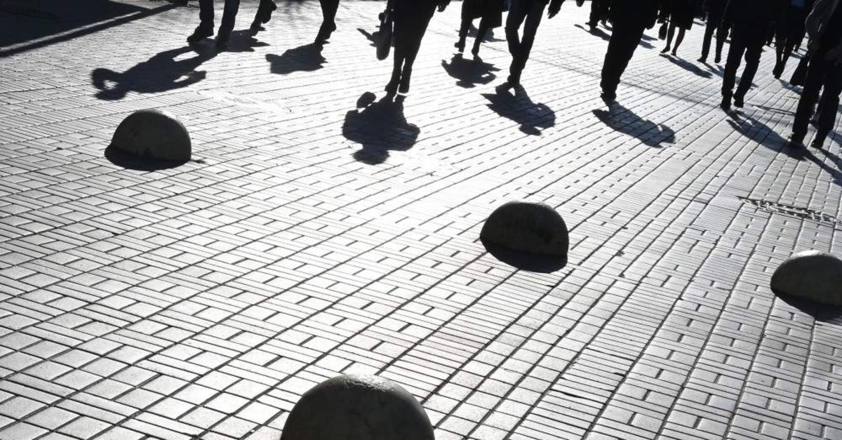Pedestrians walk on a sunny autumn day in Kiev, Ukraine, Nov. 5, 2019. (AFP)