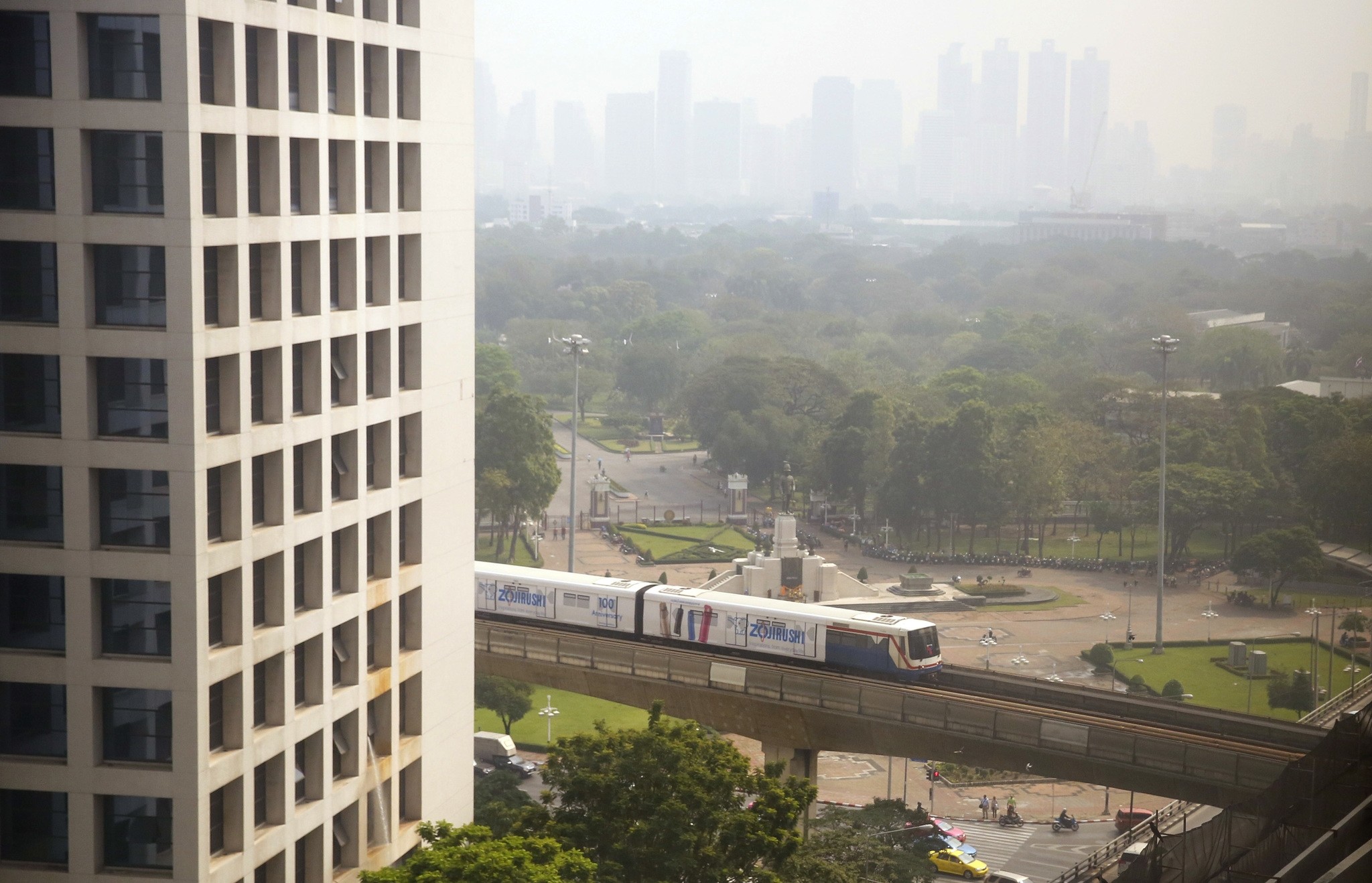 An elevated train passes in front of the Lumpini Park covered in a thick layer of smog downtown Bangkok, Thailand, early Thursday, Feb. 8, 2018. (AP Photo)