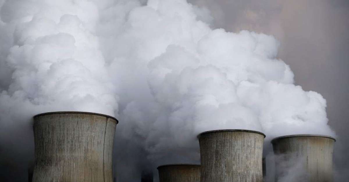 Steam rises from the cooling towers of a coal power plant in Niederaussem, Germany, March 3, 2016. (Reuters Photo)