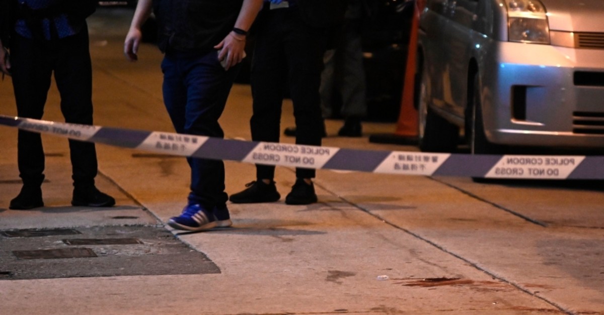 Blood is seen beyond a police cordon, where Jimmy Sham, convener of the Civil Human Rights Front (CHRF), was assaulted by four to five people wielding hammers in the Mongkok district of Kowloon in Hong Kong on October 16, 2019. (AFP Photo)