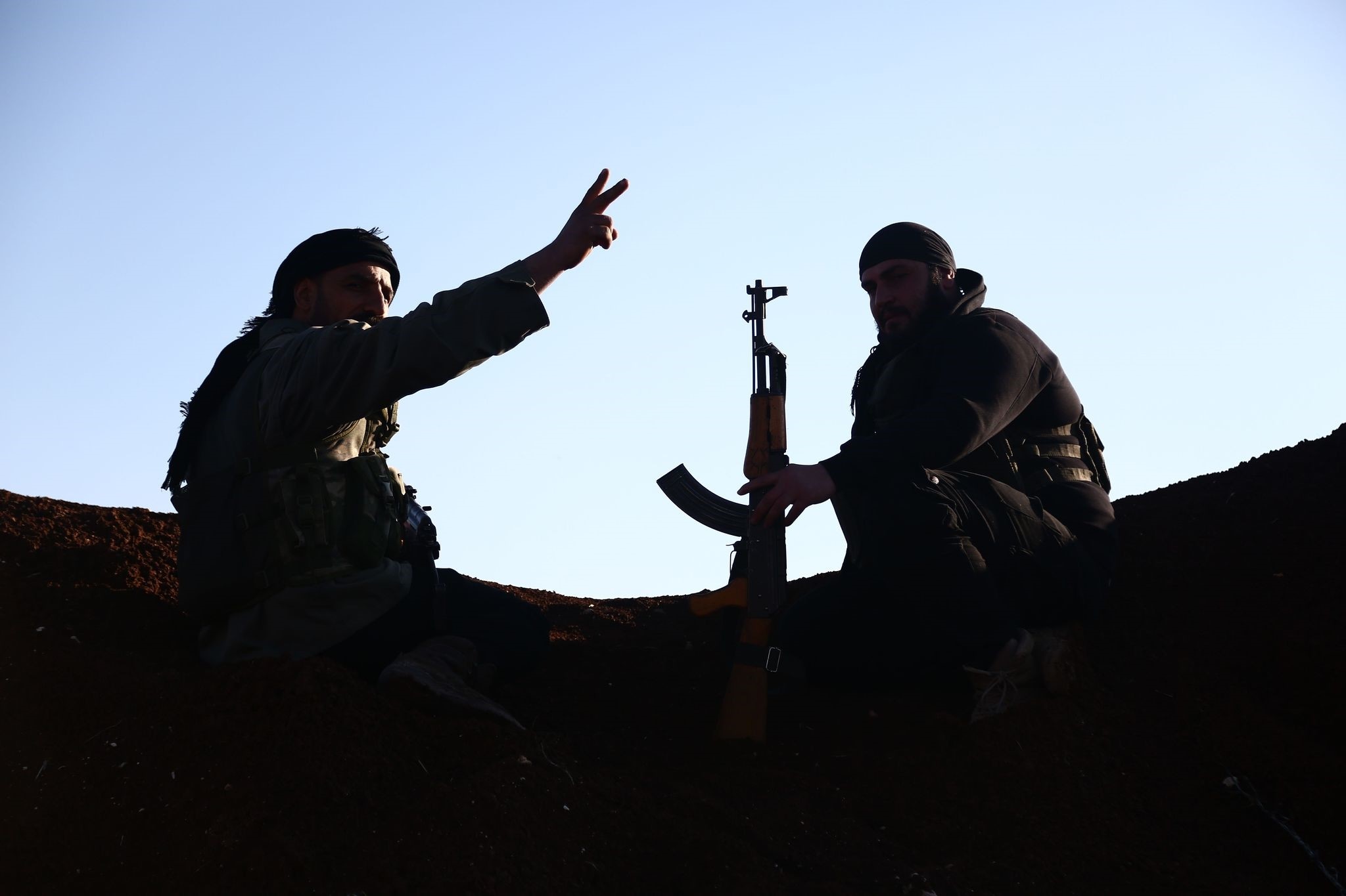 FSA fighters hold a position in the Tal Malid area, north of Aleppo, as they prepare to target YPG positions in the area of Afrin, on January 20, 2018. (AFP Photo)