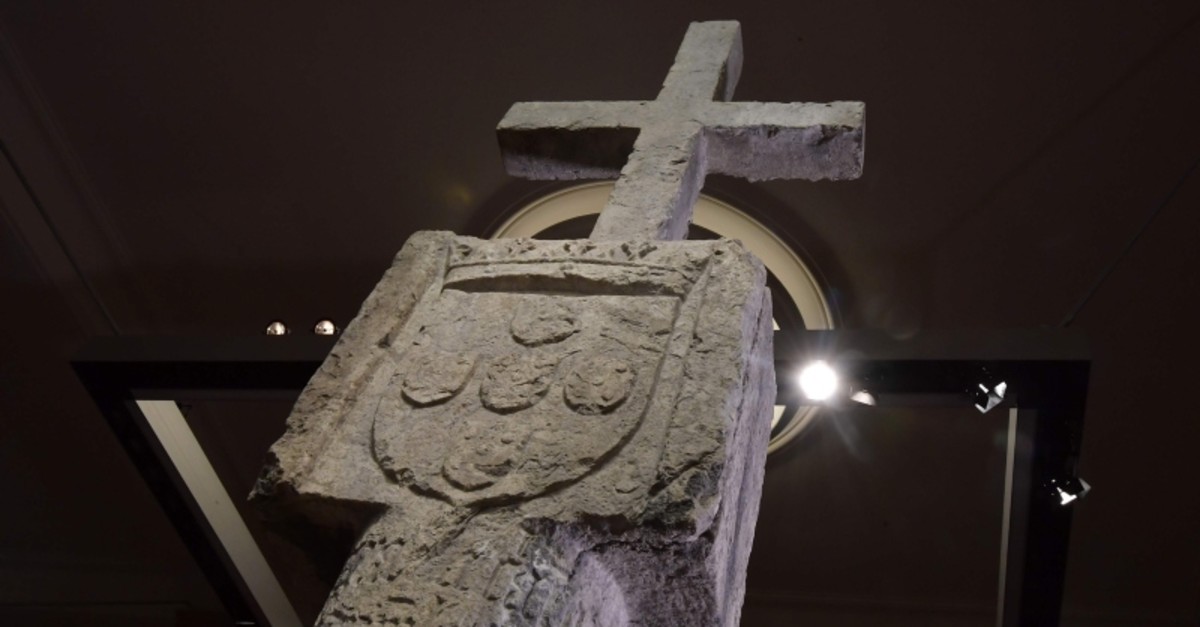 A picture taken on May 17, 2019 in Berlin shows a Stone Cross, a key 15th-century navigation landmark erected by Portuguese explorers, seen at the History Museum in Berlin (AFP Photo)