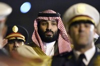 Saudi Crown Prince Mohammed bin Salman is seen behind a military band upon his arrival at Algiers International Airport on Dec. 2, 2018. (AFP Photo)