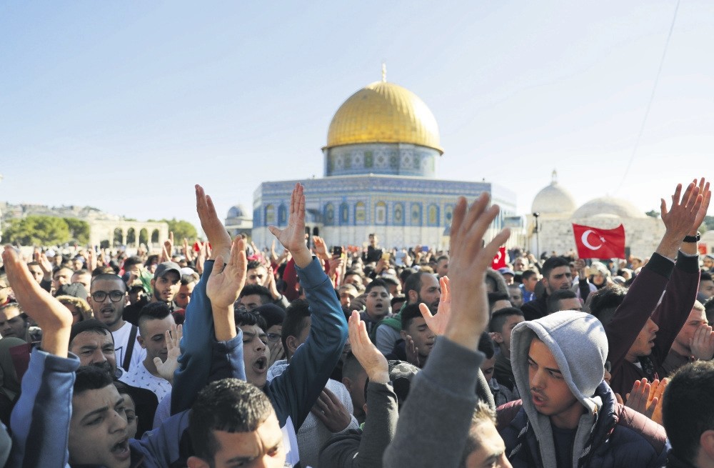 Palestinian worshippers shout slogans after Friday prayers at the Al-Aqsa Mosque compound in Jerusalem's Old City, on Dec. 8. 