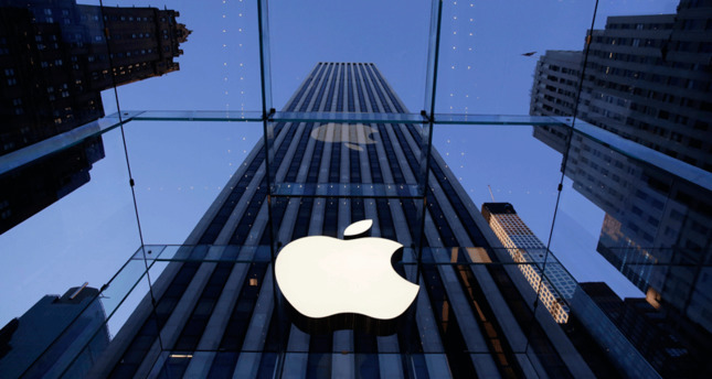 In this photo, the Apple logo hangs in the glass box entrance to the company's Fifth Avenue store, in New York (AP File Photo)