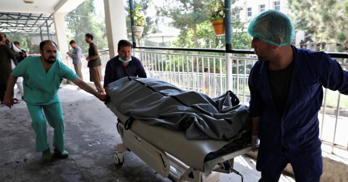 Emergency workers transport the dead body of a victim to the hospital after a blast in Kabul, Afghanistan July 25, 2019 (AFP Photo)