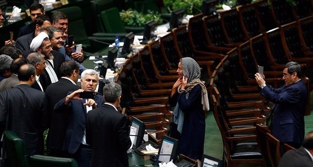 Iranian MPs take souvenir picture with EU foreign policy chief Federica Mogherini at the Iranian parliament after president Hassan Rouhani was sworn-in for his second term of presidency, at the parliament in Tehran, Iran, August 5, 2017. (EPA Photo)
