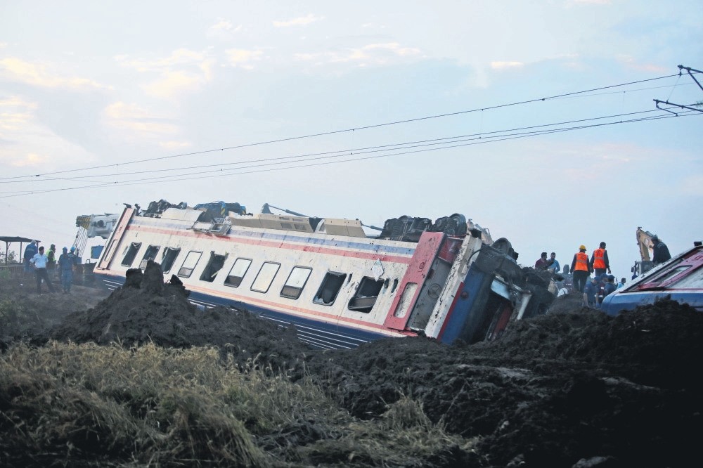 Search and rescue teams work at the site of the accident. 