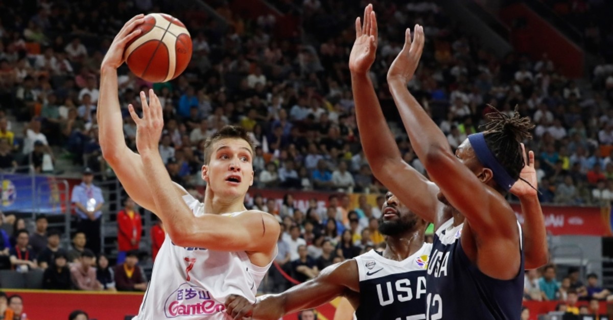 Serbia's Bogdan Bogdanovic in action with Kemba Walker and Myles Turner of the US during FIBA World Cup classification game, Dongguan Basketball Center, Dongguan, China, September 12, 2019. (Reuters Photo)