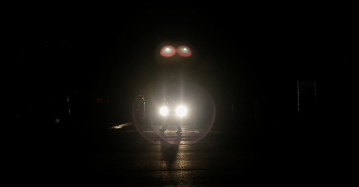 People walk on the street during a blackout in Caracas, Venezuela March 7, 2019. (Reuters Photo)