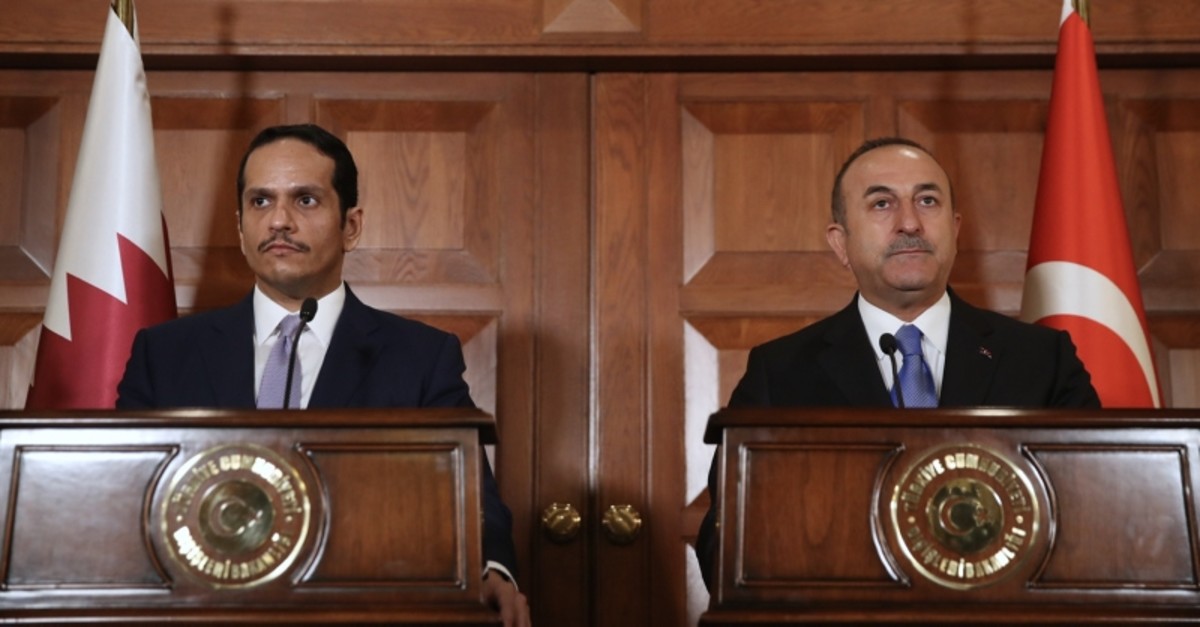 This handout picture release and taken on April 9, 2019 shows Turkey's minister for Foreign Affairs Mevlu00fct u00c7avuu015fou011flu (R) and Qatari Deputy Prime Minister and minister for Foreign Affairs Al Thani (L) during a meeting in Ankara. (AA Photo)