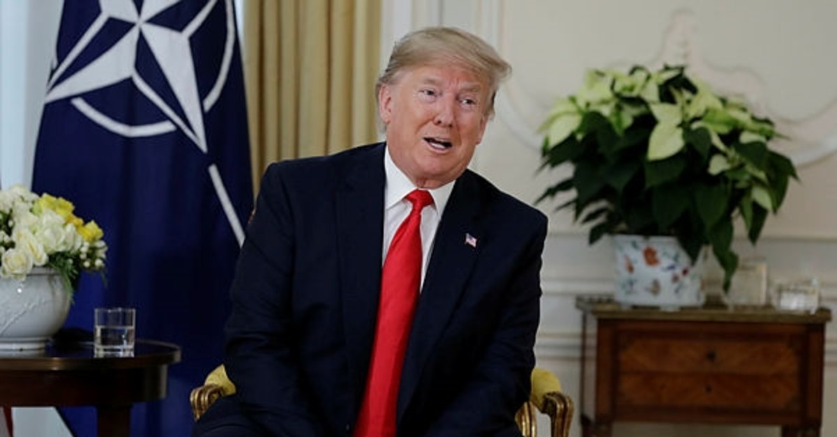 U.S. President Donald Trump speaks during a meeting with NATO Secretary General, Jens Stoltenberg at Winfield House in London, Tuesday, Dec. 3, 2019. (AP Photo)