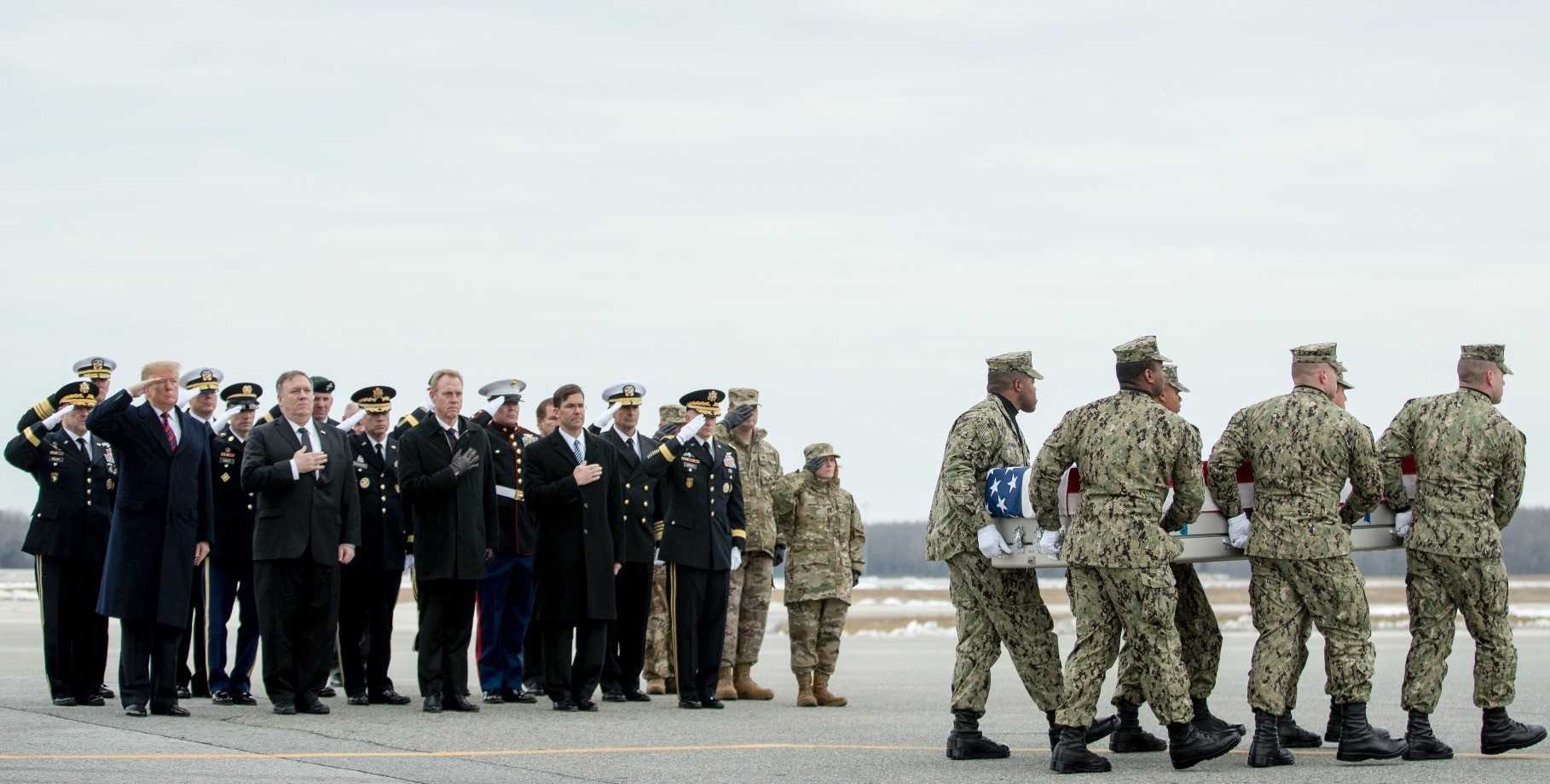 The U.S. president and high-level officials salute as a U.S. Navy team transfers the body of Scott A. Wirtz, who was killed in a suicide attack claimed by Daesh in Manbij, Syria on Jan. 16.
