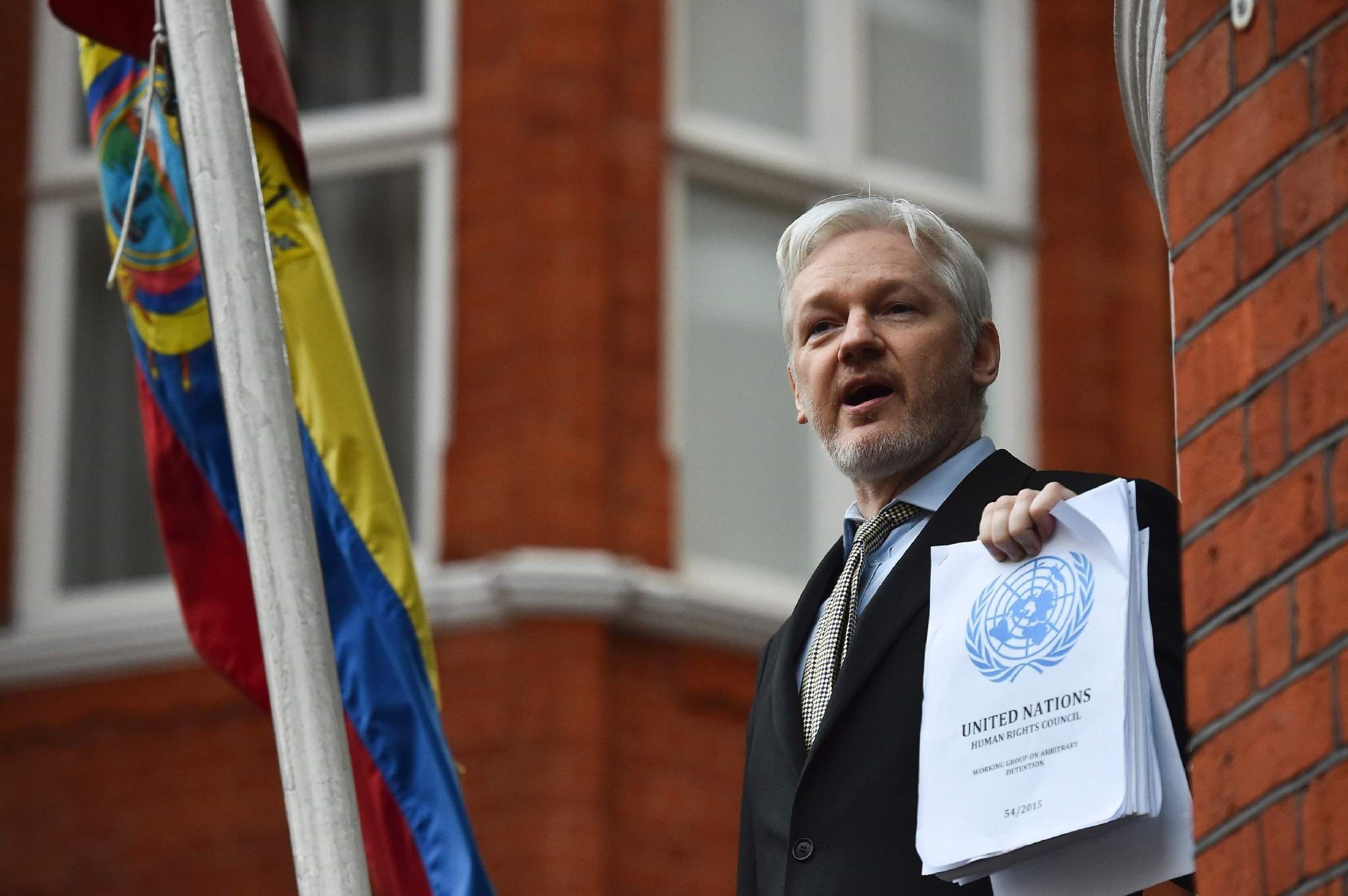 This file photo taken on February 5, 2016 shows WikiLeaks founder Julian Assange addressing the media on his case from the balcony of the Ecuadorian embassy in central London. (AFP Photo)
