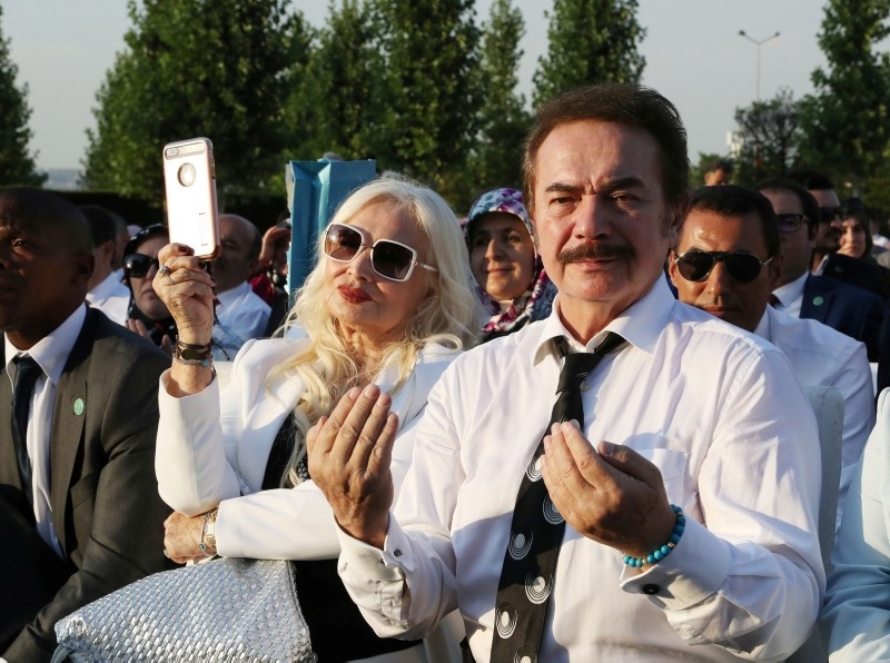 Turkish musician Orhan Gencebay and his wife Sevim Emre attend a ceremony for Erdoğan in Ankara.