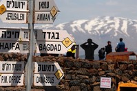 A sign for tourists shows the direction to Jerusalem, Amman, Baghdad and Damascus among other destinations at an army post on Mount Bental in the Israeli-annexed Golan Heights, March 22, 2019.