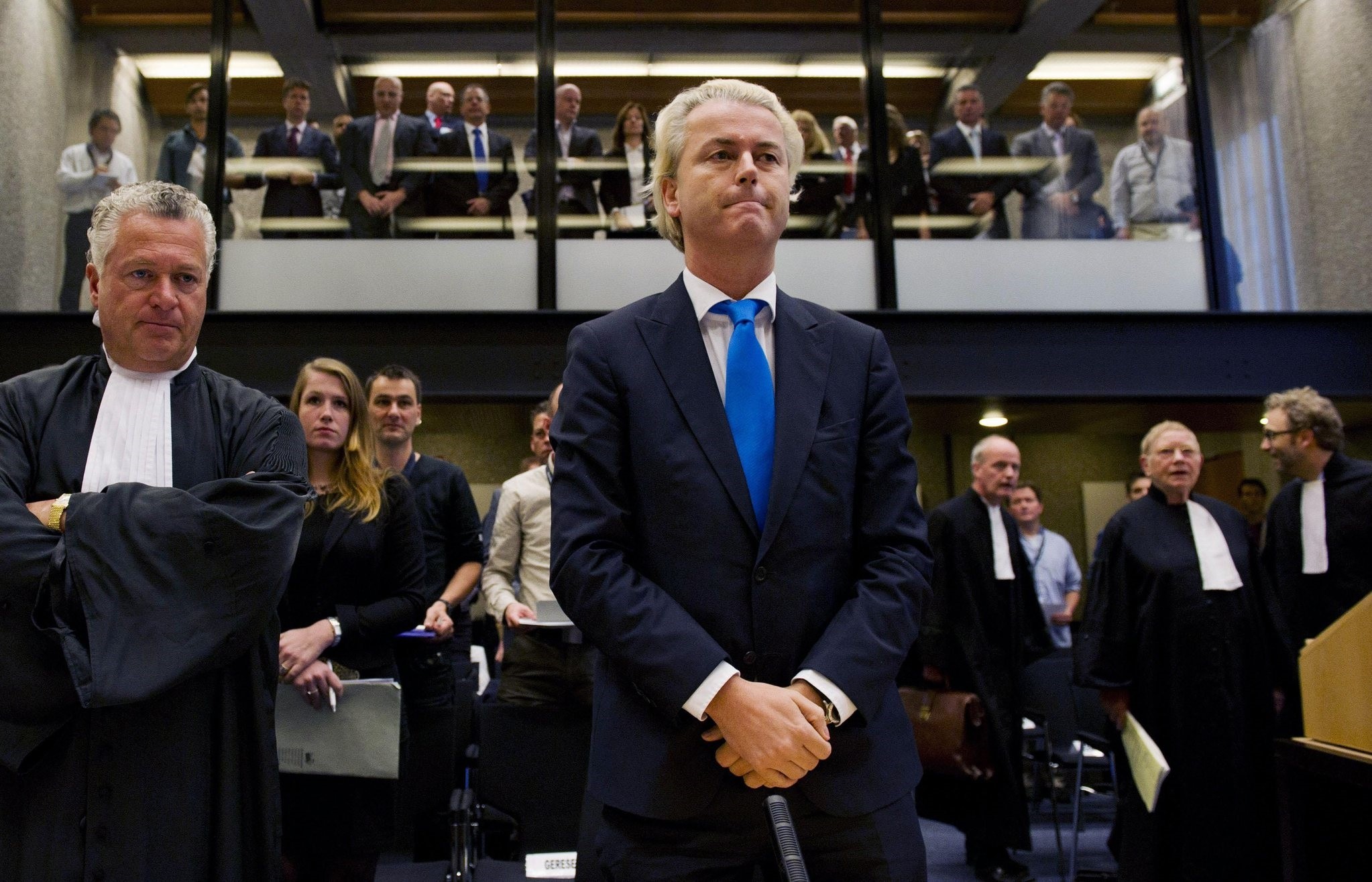 Dutch anti-Islam, far-right politician Geert Wilders (C) waits for the start of his trial at a court, Amsterdam, the Netherlands, Oct. 4, 2010. 
