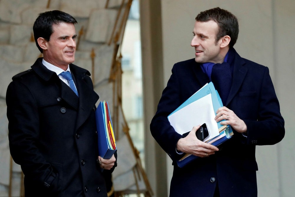 Former French Prime Minister Manuel Valls  and President-elect Emmanuel Macron leave the Elysu00e9e palace in Paris, France.