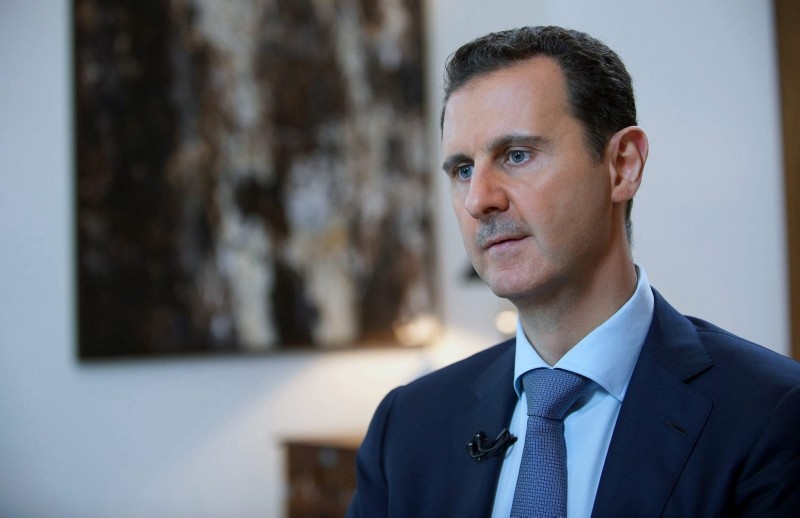 In this Sunday, Oct. 4, 2015 file photo released by the Syrian official news agency SANA, shows Bashar Assad, speaking during an interview with the Iran's Khabar TV, in Damascus, Syria. (SANA via AP)