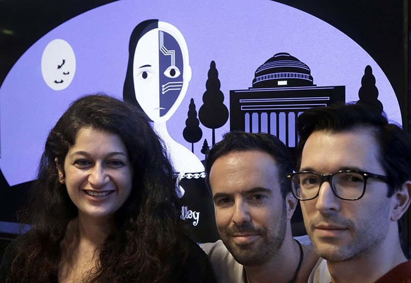 The bot's makers pose for a photo: (R to L) MIT postdoctoral associate Pu0131nar Yanardau011f, of Istanbul, Turkey, research scientist Manuel Cebrian, of Madrid, Spain, and associate professor Iyad Rahwan, of Aleppo, Syria (AP Photo)