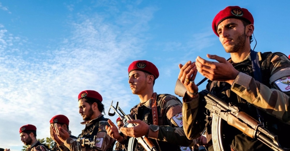 Ppoto shows FSA commanders praying in Manbij, Syria during Operation Euphrates Shield. (FILE Photo)
