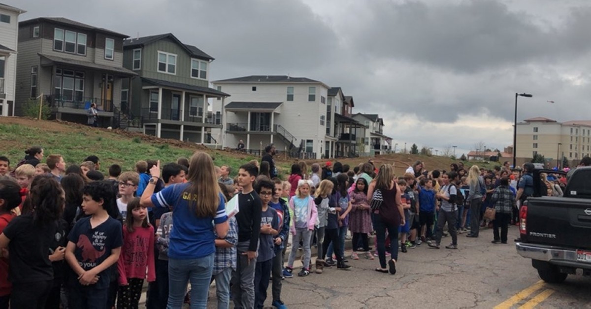 People wait outside near the STEM School during a shooting incident in Highlands Ranch, Colorado, U.S. in this May 7, 2019 image obtained via social media. (SHREYA NALLAPATI/VIA REUTERS) 