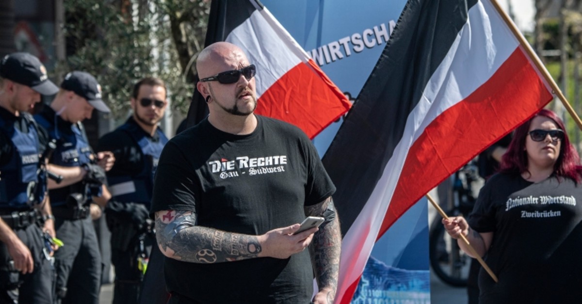 A man participates in a demonstration of the German far-right party 'Die Rechte' in Ingelheim, Germany, Saturday, April 20, 2019 (AP Photo)