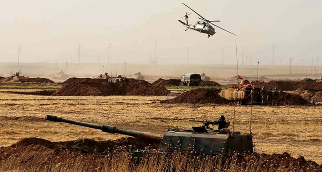 A Turkish military helicopter flies near the Habur border gate between Turkey and the Iraqi Kurdish region in Şırnak province, Turkey. (AA Photo)