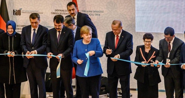German Chancellor Angela Merkel C and President Recep Tayyip Erdo?an attend the official opening ceremony of the Turkish-German University's new campus in Istanbul, Jan. 24, 2020. AFP Photo