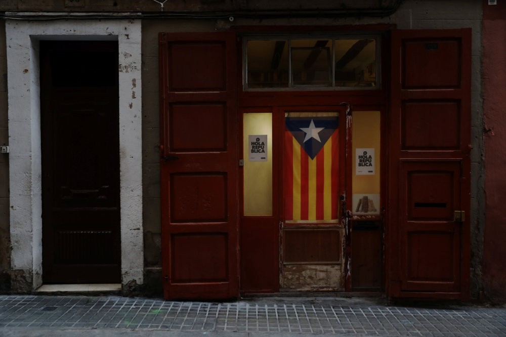 An Estelada (Catalan flag) hangs from a door, Barcelona, Oct. 4.