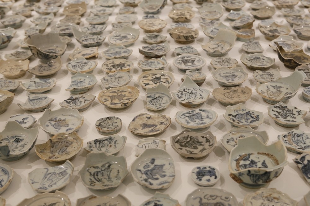 Wei has a vast collection of broken old porcelain, all bearing a tiger figure unique to the dynasty.