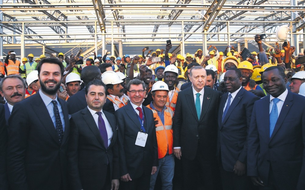 President Erdou011fan (third from right) and Senegalese President Macky Sall (second fom right) visit a construction site of a Turkish contractorww, Dakar, March 1.