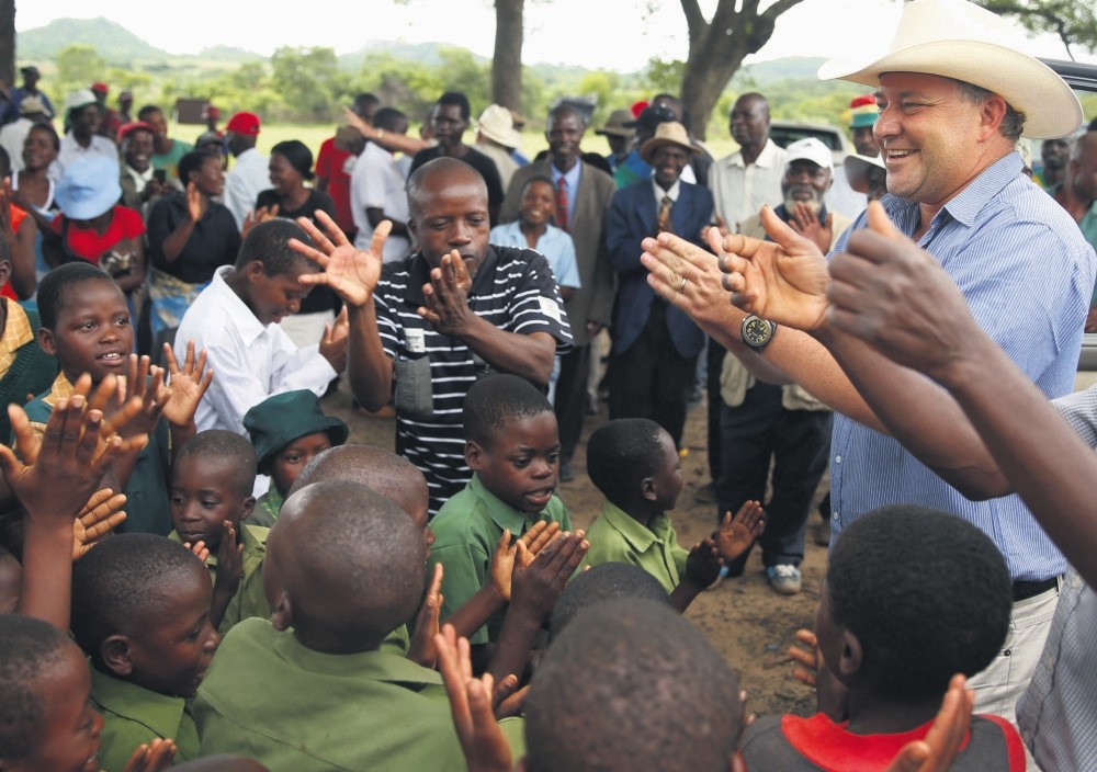 Robert Smart is the first to have his farm returned. Some war veterans and local traditional leaders joined farm workers and villagers in song to welcome his family home.