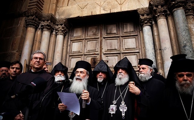 Greek Orthodox Patriarch of Jerusalem, Theophilos III, speaks during a news conference with other church leaders in front of the closed doors of the Church of the Holy Sepulchre in Jerusalem's Old City, February 25, 2018. (Reuters Photo)