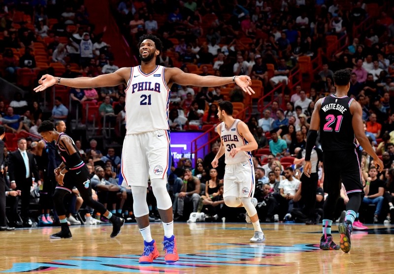 Philadelphia 76ers center Joel Embiid (21) reacts after making a 3-point basket over Miami Heat's Hassan Whiteside (21) during the 2nd half at American Airlines Arena. Furkan Korkmaz (30) is in the background. (Steve Mitchell-USA TODAYSports/Reuters)